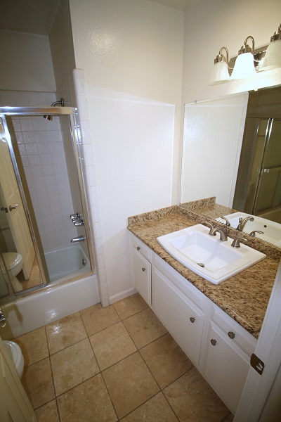 Full Bathrrom with Granite Counter and Travertine Floor