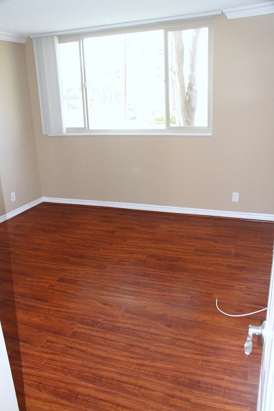 Large second bedroom with hardwood floor