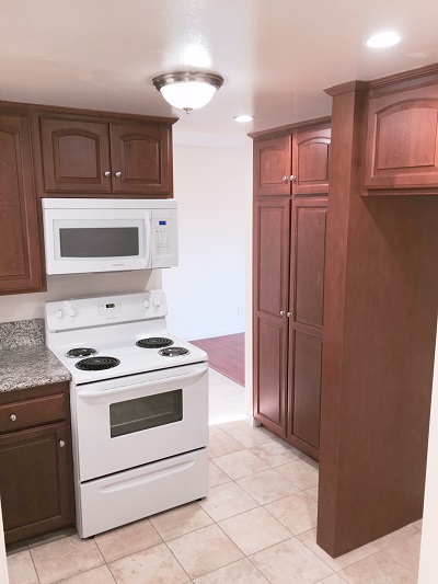 New kitchen with Cherry wood cabinets, imported granite counters and Travertine marble floor