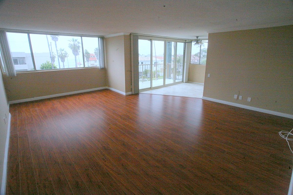 Humongous living room with hardwood floor and ocean view