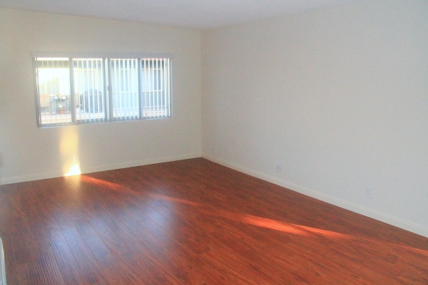 Large living room with hardwood floors overlooking Resort like Pool