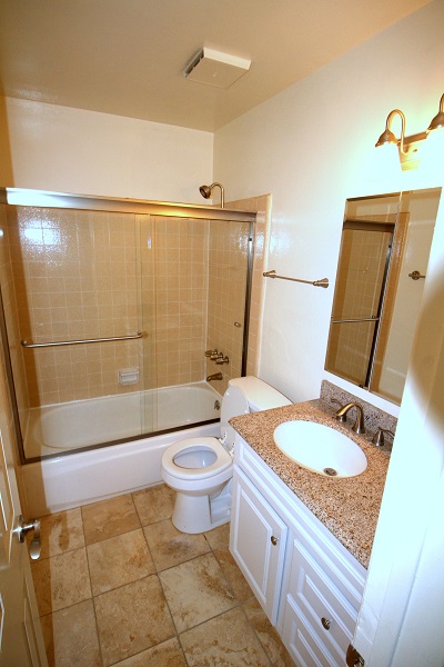Full Lower Level Bathroom with Granite counter and Travertine Floor