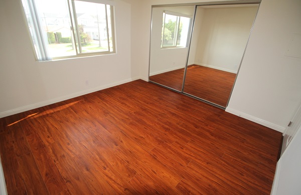 Large Master Bedroom with hardwood floor and Balcony Access