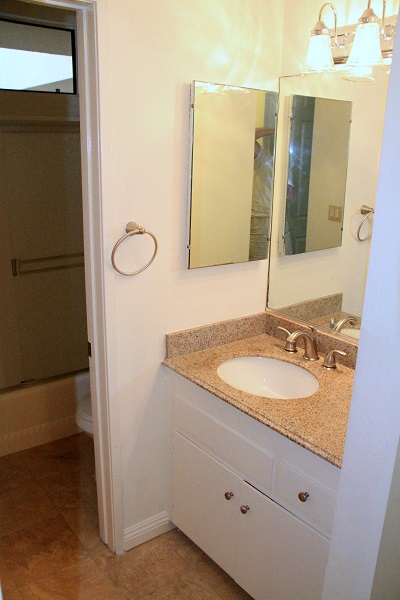 Full bathroom with granite and marble